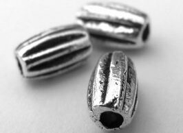 Korálky kovové 7 x 4 mm Sezam - A40138